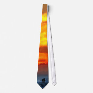 Lovers on a sunset beach tie