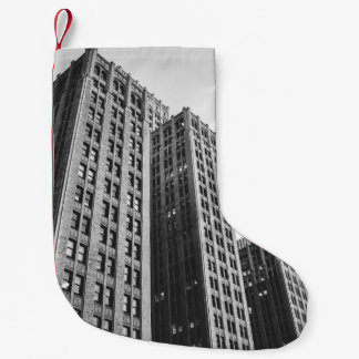 LOW ANGLE GRAYSCALE PHOTOGRAPHY OF HIGH-RISE BUILD SMALL CHRISTMAS STOCKING