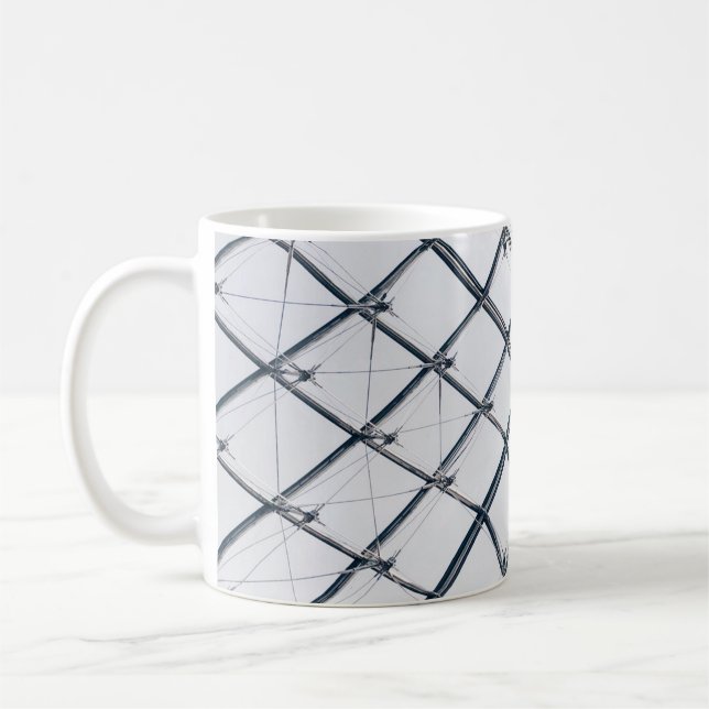 Low-angle photo of grey metal frame coffee mug (Left)