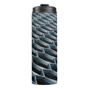 Low-angle photo of high-rise building thermal tumbler