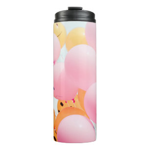 Low-angle photo of pink and orange balloons thermal tumbler