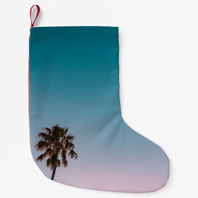 Low-angle photograph of three palm trees under blu small christmas stocking (Front)