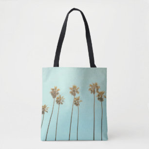 Low angle photography coconut tree tote bag