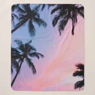 Low-angle photography coconut trees during golden sherpa blanket