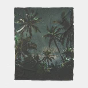 LOW ANGLE PHOTOGRAPHY OF A COCONUT TREES WITH STAR FLEECE BLANKET