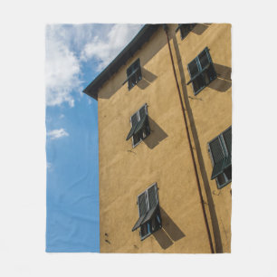LOW ANGLE PHOTOGRAPHY OF BROWN LOUVER WINDOW FLEECE BLANKET