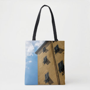 LOW ANGLE PHOTOGRAPHY OF BROWN LOUVER WINDOW TOTE BAG