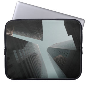LOW ANGLE PHOTOGRAPHY OF BUILDINGS AT DAYTIME LAPTOP SLEEVE