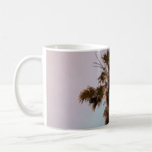 Low-angle photography of palm plant coffee mug