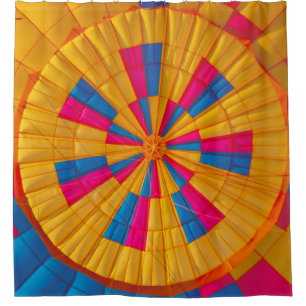 Low angle photography of yellow, pink, and black h shower curtain
