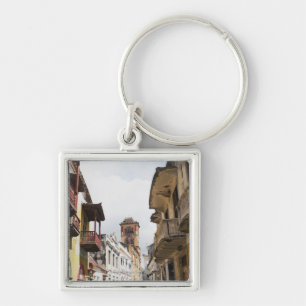 Low angle view of apartments along the street key ring