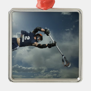 Low angle view of jai-alai player jumping metal tree decoration