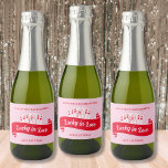 Lucky In Love Vibrant Pink & Red Bachelorette Sparkling Wine Label<br><div class="desc">Pop the bubbly and toast to love with our 'Lucky in Love' bachelorette party champagne labels! Featuring the captivating Queen of Hearts and a hand-drawn woman outline gracefully holding a champagne glass, these labels are the epitome of elegance and excitement in bold pink and red hues. Whether you're celebrating poolside...</div>