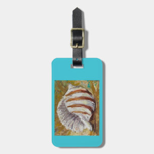 Luggage tag with conch shell