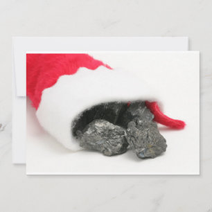 Lumps of coal spilling out of a Christmas Holiday Card