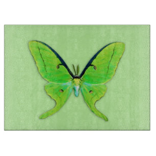Luna moth on a pale green background cutting board