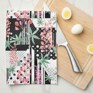 Lupines on a patchwork black and white background tea towel