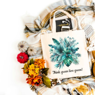 Lush green tropical leaves  tote bag