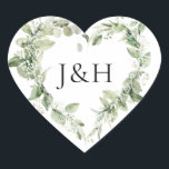 Lush White Flowers and Greenery Monogram Wedding Heart Sticker<br><div class="desc">Seal your wedding invitation envelopes or favours with our elegant floral wedding stickers featuring your monogram initials surrounded by a heart-shaped wreath of painted white gardenia flowers, sprigs of baby's breath, dahlias, sage green fern leaves, and vibrant green leaves. Designed to coordinate with our Lush White Flowers and Greenery collection....</div>