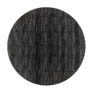 Luxurious crocodile leather: textile texture. cutting board