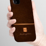Luxury elegant gold glitter brown monogrammed iPhone 16 case<br><div class="desc">Classy exclusive looking office or personal monogrammed phone case featuring a faux copper metallic gold glitter square with your monogram name initials and a sparkling stripe over a stylish dark brown faux leather background. Suitable for small business, corporate or independant business professionals, personal branding or stylists specialists, makeup artists or...</div>