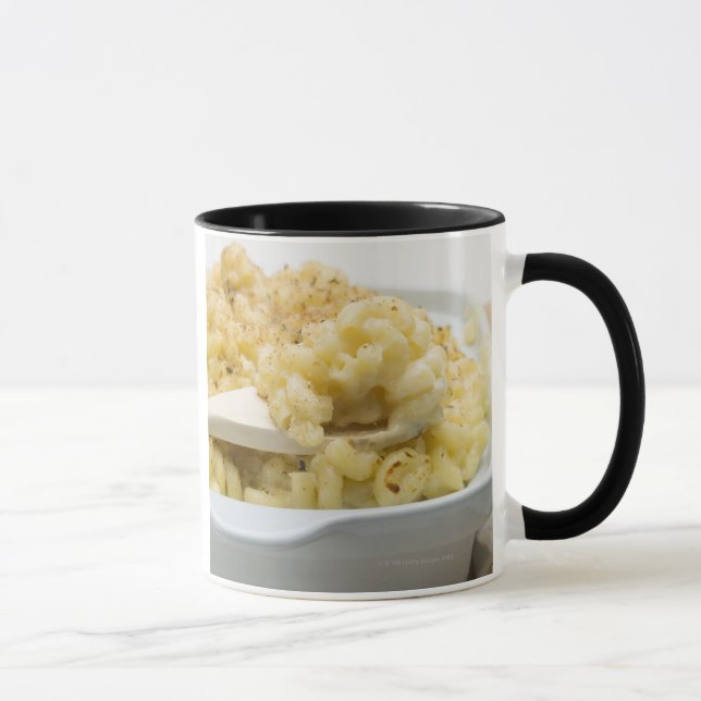 Macaroni cheese in baking dish with wooden mug (Right)