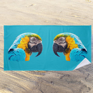 Macaw portrait on a turquoise background beach towel