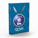 Maccabee Shield And Spears Photo Block<br><div class="desc">Chag Sameach! A depiction of a Maccabee's shield and two spears. The shield is adorned by a lion and text reading "Yisrael" (Israel) in the Paleo-Hebrew alphabet. Modern Hebrew text reading "Maccabee" also appears. The Maccabees were Jewish rebels who freed Judea from the yoke of the Seleucid Empire. Chanukkah is...</div>
