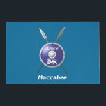 Maccabee Shield And Spears Placemat<br><div class="desc">A depiction of a Maccabee's shield and two spears. The shield is adorned by a lion and text reading "Yisrael" (Israel) in the Paleo-Hebrew alphabet. English text reading "Maccabee" also appears. Customisable text reading "Happy Chanukkah! appears on the reverse side. The Maccabees were Jewish rebels who freed Judea from the...</div>