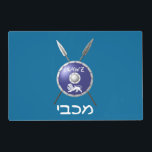 Maccabee Shield And Spears Placemat<br><div class="desc">A depiction of a Maccabee's shield and two spears. The shield is adorned by a lion and text reading "Yisrael" (Israel) in the Paleo-Hebrew alphabet. "Maccabee" also appears in modern Hebrew. Customisable text reading "Happy Chanukkah! appears on the reverse side. The Maccabees were Jewish rebels who freed Judea from the...</div>