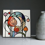 Mackintosh Art Deco Abstract Floral Wall Decor Tile<br><div class="desc">This ceramic tile features bold geometric shapes and intricate floral patterns reminiscent of the iconic style of Mackintosh. He was a prominent Scottish architect, designer, and artist of the Art Nouveau movement. Clean lines, geometric shapes, and a strong sense of symmetry characterise his work. These elements are beautifully represented in...</div>