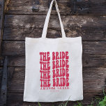 Magenta Boho Trendy Boho Retro Personalised Bride Tote Bag<br><div class="desc">Are you looking for the perfect gift for your upcoming bachelorette party? Look no further than our personalised tote bags! Each tote bag is made with high quality materials and features a unique, trendy design that will perfectly match your style. Plus, each tote bag is personalised with your own unique...</div>
