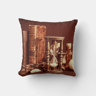 Magic books in vintage basket, hourglass, hallowee cushion
