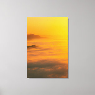 Magical autumn sunrise above clouds canvas print