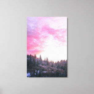 Magical bright pink sunset above snowy forest canvas print