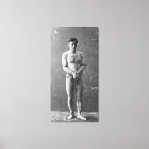 Magician Harry Houdini Standing In Chains Canvas Print