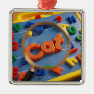 Magnifying glass enlarging view of word CAT Metal Tree Decoration