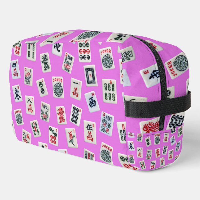 Mahjongg tiles symbols design on pink dopp kit (Left Corner)
