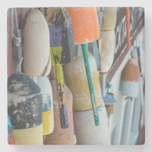 Maine, Bar Harbour. Colourful lobster trap buoys Stone Coaster