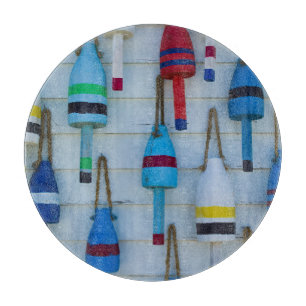 Maine, Stonington, decorative lobster buoys Cutting Board