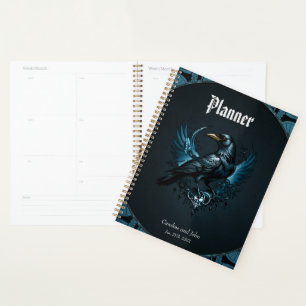 Majestic black raven sitting on an ornate, planner