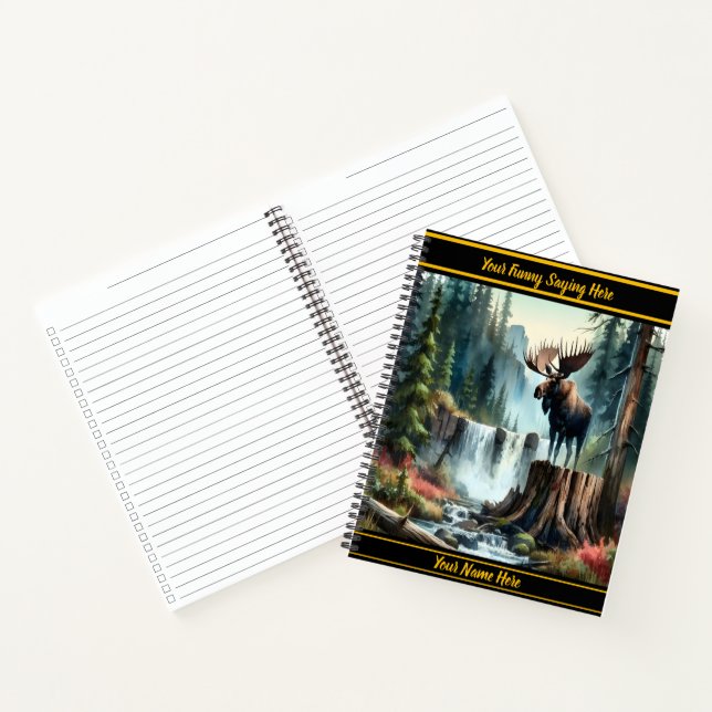 Majestic moose standing proudly beside a waterfall notebook (Inside)