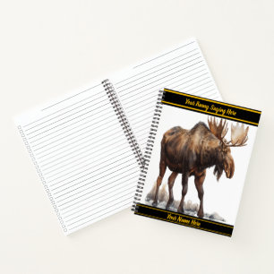 Majestic moose wandering through a snowy landscape notebook