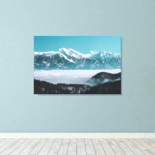 Majestic mountains rising over foggy valley canvas print
