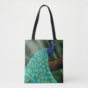 Majestic Plumage: Enchanting Peacock in the Forest Tote Bag