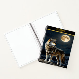 Majestic wolf howling at the luminous moonlight notebook