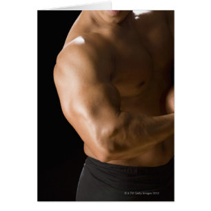 Male bodybuilder flexing muscles, front view, 2