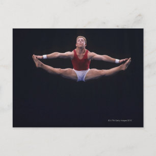 Male gymnast performing on the floor exercise postcard