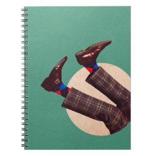 Male legs stacking in round on pastel geometrical  notebook
