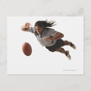 Male rugby player diving for ball postcard